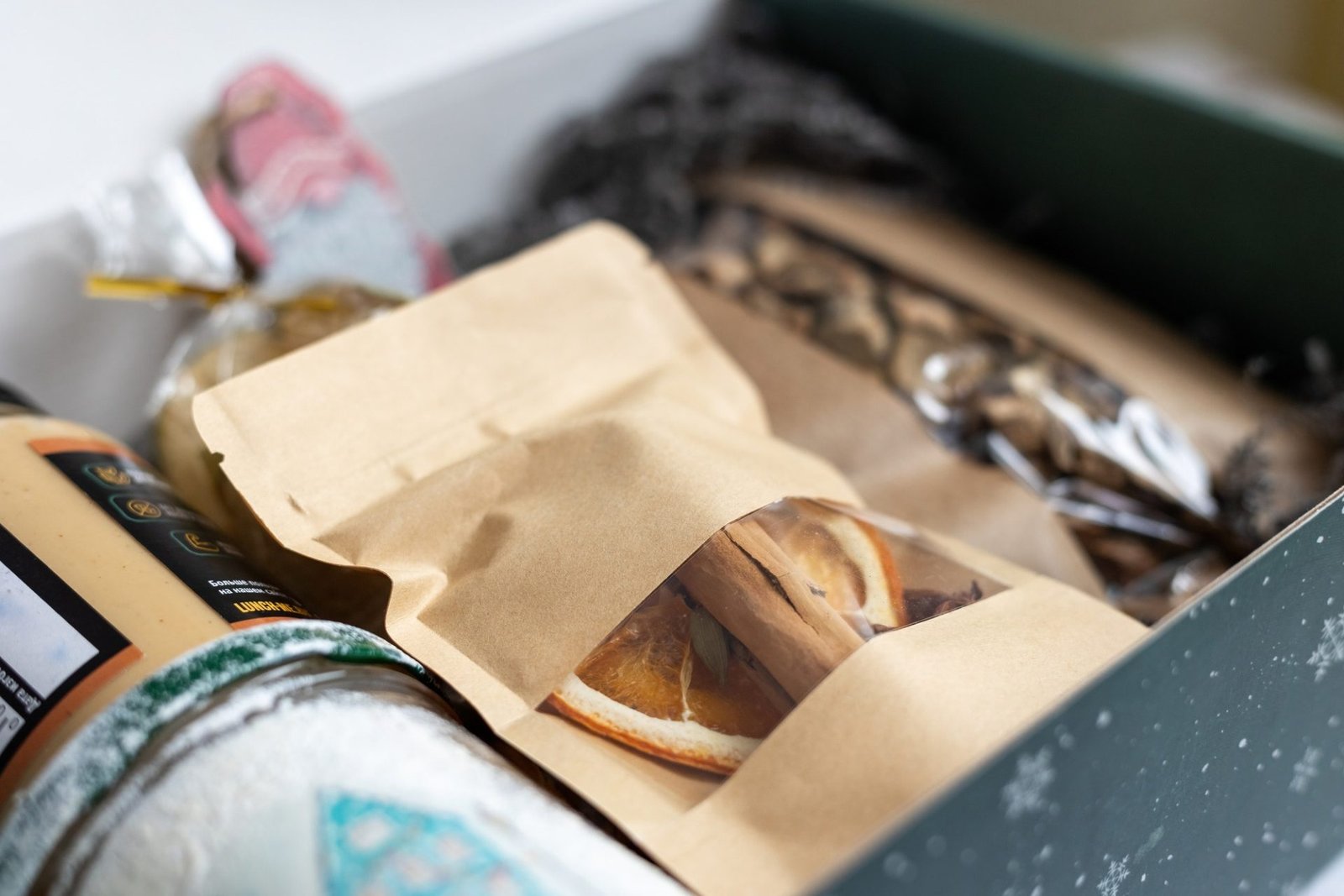The idea of packaging and gift. A box for an autumn or winter gift with sweets and dried vegetables,